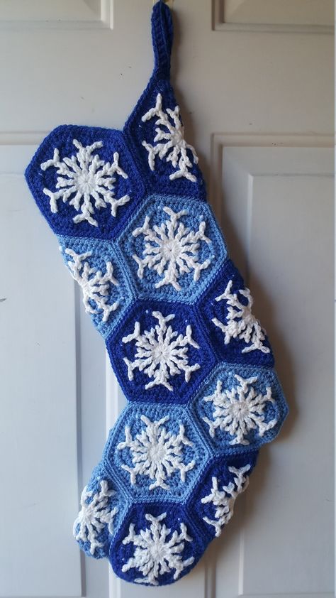 At 23 inches long, this stocking leaves lots of room for range of goodies! Adorned with snowflakes to bring a touch of winter charm to your holiday decor.  Made in a smoke-free home. Made with 100% acrylic yarn. Design credit: https://www.ravelry.com/patterns/library/snowflake-hexagon-2 Crochet Snowflake Sweater, Crochet Hexagon Christmas Stocking, Crochet Stocking Decoration, Crochet Christmas Snowflake Blanket, Snowflake Stocking, Christmas Ribbon Crafts, Crochet Stocking, Crochet Christmas Stocking, Walla Walla