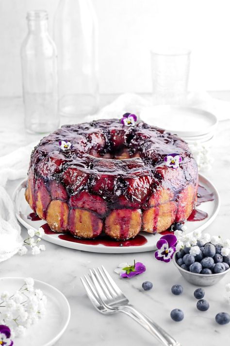 Indulge in the ultimate pull-apart bread recipe with our gooey and delicious Lemon Blueberry Monkey Bread! This delightful twist on a classic promises a burst of citrusy sweetness in every bite. Whether for brunch, a sweet snack, or a show-stopping dessert, this monkey bread is the perfect treat to share with friends and family! Blueberry Monkey Bread, Lemon Monkey Bread, Breakfast Brunch Party, Homemade Blueberry Syrup, Bread Twists, Bread Pull Apart Recipes, Bakers Table, Breakfast Meat, Blueberry Syrup