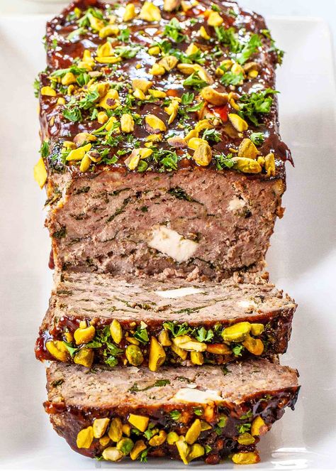 Greek Meatloaf with Spinach and Feta! Tangy, garlicky, and savory—this Greek meatloaf gets flavor boosts from spinach, feta and pomegranate molasses, a common ingredient in Mediterranean food. #meatloaf #feta #spinach #simplyrecipes Feta Meatloaf, Meatloaf With Spinach, Greek Meatloaf, Feta Recipe, Classic Meatloaf, Spinach Feta, Feta Recipes, Best Meatloaf, Greek Flavors