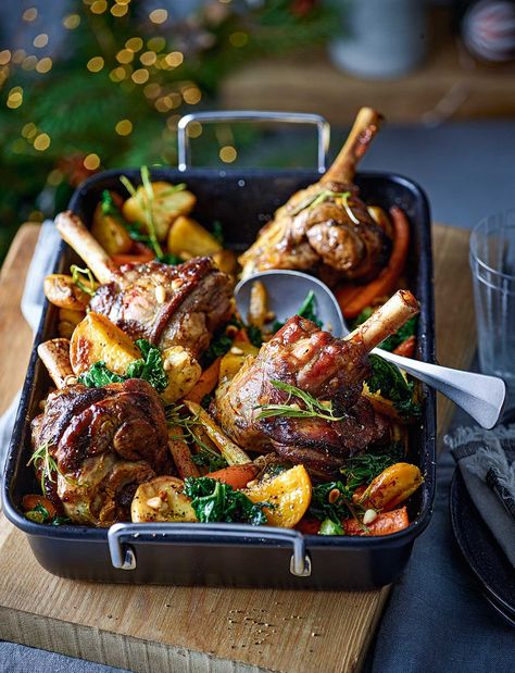 This aromatic, slow-cook lamb shanks recipe, served on a bed of roasted root vegetables, is an effortless meal to enjoy over the Christmas period. It takes just 15 minutes of prep before going in the oven, so you can enjoy time with guests Lamp Shanks Recipe, Fall Lamb Recipes, Lamb Shank Recipe Oven, Christmas Lamb Recipes, Roasted Meat Recipes, Christmas Feast Dinner, Vegetables Platter, Best Grilled Vegetables, Shanks Recipe