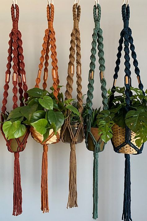 **Please note that all sales are final.** u00a0 Add a breath of fresh air to your home by hanging some of your favorite plants. The combination of the twisted cord and copper embellishments will bring that perfect modern boho flare to any room. Each plant hanger is made out of 100% recycled cotton cord and can hold up to a pots size of 6” wide. Pots and plants not included. u00a0 **Contents** * 100% recycled cotton * Copper beads u00a0 **Care/Import** * Hand wash * Handmade in the USA u00a0 **Dimensions** *36” long from top of hanger to the end of tassel | I Would Rather Knot Macrame Plant Hanger With a Twist at Free People in Red 70s Macrame Plant Hanger, Plant Pot Macrame, Decorating House With Plants, Boho Plant Hanger, Wall Hanging Decorations, Jute Macrame, Knot Macrame, Indoor Plant Hangers, Crazy Crafts