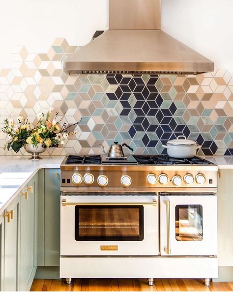 Looking for a way to artfully upgrade your kitchen? Check out this gradient backsplash design. A gradient backsplash is a unique way to add color to what would otherwise be a conventional design. Gradient transitions allow for either a subtle movement between similar hues or a more striking movement connecting vastly different color palettes—we use them to add distinct personality to projects. Modern U Shaped Kitchens, Handmade Tile Backsplash, Custom Tile Design, Modern Kitchen Renovation, Stove Backsplash, Серая Кухня, Mercury Mosaics, Kitchen Backsplash Designs, U Shaped Kitchen