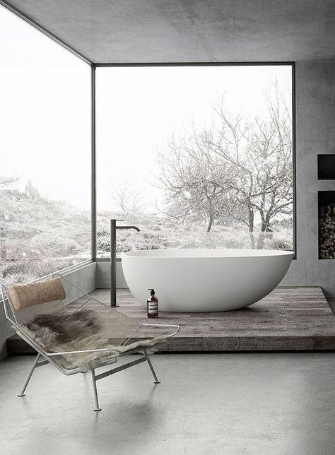 a gorgeous grey bathroom done with concrete, with glazed walls, a fireplace and a tub on a platform Taupe Bathroom, Grey Bathrooms Designs, Tub Remodel, Bedroom With Bath, Glazed Walls, Casa Country, Grey Bathroom, Bad Inspiration, Outdoor Bathrooms