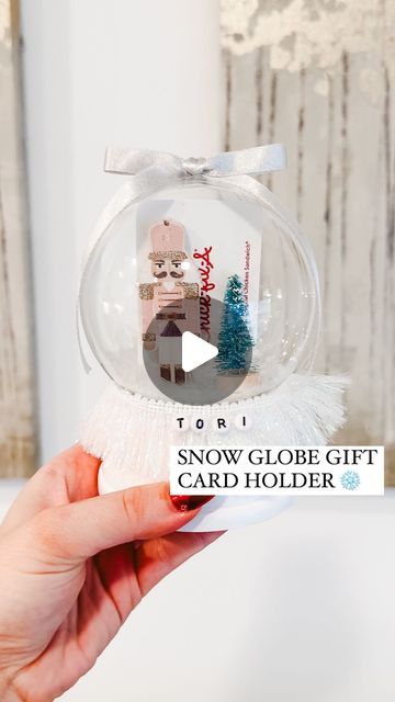 Shelby Parks on Instagram: "How to ✨zhuzh up✨ a gift card!  Comment HOLDER for everything I used to make them!   These snow globe gift card holders turned out soooo cute! I made these for my @orangetheory coaches and was obsessed with how they turned out. Here’s how to make them!   #diy #diycrafts #howto #giftcardholder #giftideas #giftidea #diygifts #diygift #lastminutegift #christmasgiftideas #giftwrappingideas #giftwrapping" Christmas Ball Gift Ideas, Diy Snow Globe Gift Card Holder, Teacher Christmas Gift Ideas Giftcard, Gift Card Ornaments Diy, Snow Globe Teacher Gift, Money Ornaments Diy, Snowglobe Gift Card Holder, Snow Globe Gift Ideas, Gift Card Snow Globe Diy