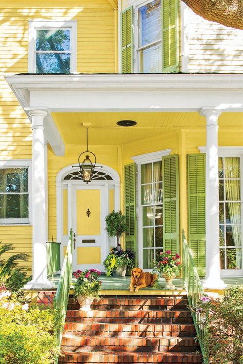 As long as you are painting the door, why not pain the whole house? Yellow and green is just about as springtime as it gets. #springcurbappeal #frontdoorideas #frontdoorpaintcolors #southernliving Yellow House Exterior, Green Shutters, Yellow Cottage, Yellow Door, Yellow Doors, Yellow House, Painted Front Doors, Exterior Paint Colors For House, Yellow Houses