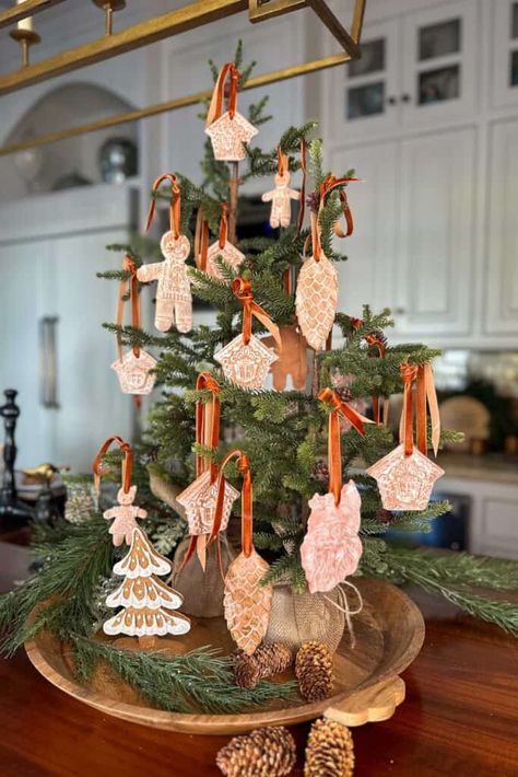 Add a personal touch to your holiday decor with these DIY air-dry clay gingerbread ornaments! Follow this simple tutorial for festive fun. Air Dry Clay Gingerbread Man, Diy Air Dry Clay Christmas Decorations, Gingerbread House Ornaments Diy, Diy Clay Christmas Decorations, Air Dry Clay Ornaments Christmas, Clay Gingerbread Ornaments, Air Dry Clay Ornaments Diy, Diy Gingerbread Ornaments, Gingerbread Ornaments Diy