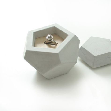 Conceal the prized bauble in a geometric faceted box with a smooth exterior. Concrete Objects, Unique Ring Box, Concrete Ring, Jewelry Packaging Design, Engagement Ring Dish, Concrete Jewelry, Proposal Ring Box, Pandora's Box, Ring Boxes