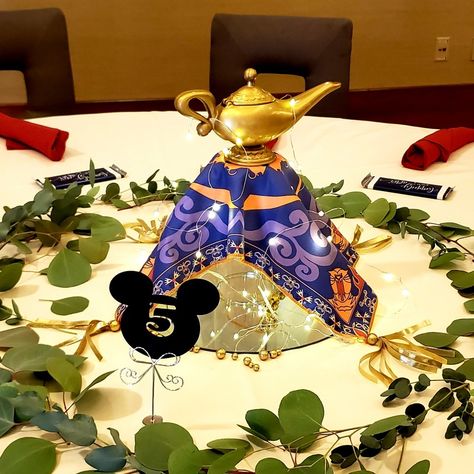 Aladdin magic carpet towel, genie lamp Genie Lamp Centerpiece Ideas, Genie Lamp Bag, Aladdin Lamp Aesthetic, Aladdins Lamp, Aladdin Genie Lamp, Disney Centerpieces, Aladdin Magic Carpet, Genie Lamp, Magic Carpet