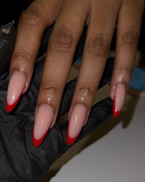 Gel Polish Almond Nails, Almond Nails With Red Tips, Nude Nails With Red Design, Red Bottom Almond Nails, Red French Tip Nails Black Women, Fall Red Almond Nails, Almond Red French Tip, Red Pointed Almond Nails, Almond Shape Red Nails