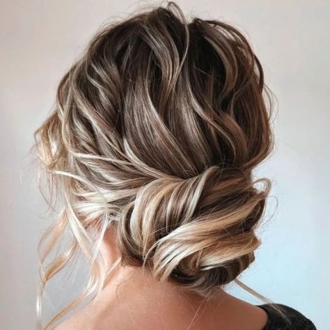 Loose Twisted Low Bun Twisted Low Bun, Loose Chignon, Twisted Bun, Messy Hair Updo, Loose Updo, Mother Of The Bride Hair, Hair Adviser, Curly Updo, Updo Styles