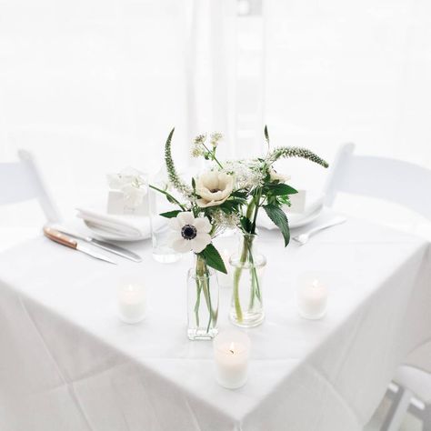 We love #anemone! White on white with a little pop of green is always a classic style when it comes to florals. From a white on white reception at @ici_brooklyn. Photo by @mariadanielledoka #wedding #flowers #anenomies Anemone Bud Vase Centerpiece, Anemone Bud Vase, Anemone Centerpiece, Midnight Blue Suit, Bud Vases Wedding, Bud Vase Centerpiece, Gold Wedding Inspiration, Modern Inspiration, Restaurant Table