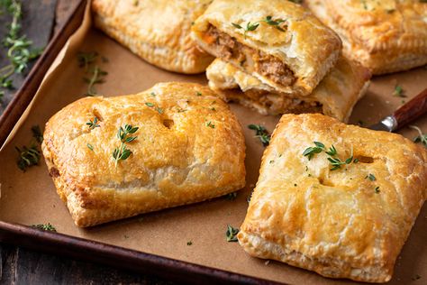 Hot and flaky, these savory hand pies are brimming with a rich, saucy filling of ground beef, diced potatoes, veggies and fresh thyme! | thecozyapron.com #savoryhandpies #savoryhandpiesrecipes #savoryhandpieseasy #savoryhandpiesmeat #savoryhandpieswithpremadepiecrust Savory Hand Pies Recipes Easy, Breakfast Hand Pies Savory, Savory Hand Pie, Savory Hand Pies, Savory Pies Meat, Savory Hand Pies With Premade Pie Crust, Savory Hand Pies Recipes, Hand Pies Savory, Hand Pie Recipes