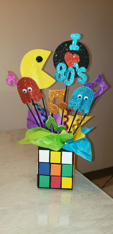 90s Theme Table Decorations, 80s Party Centerpiece Ideas, Decades Table Decorations, 80s Music Party Decorations, 80s Theme Centerpieces Diy, Diy 80s Centerpieces, 80s Theme Table Centerpieces, Retro Centerpieces Table Decorations, Colorful Centerpieces For Party