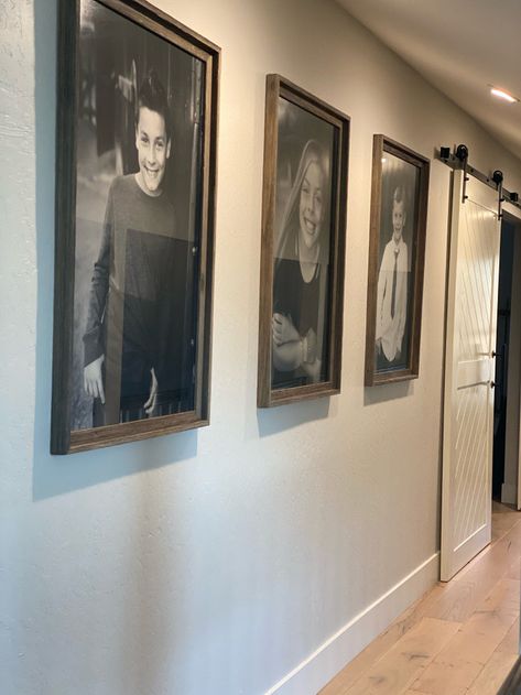 Portrait Display Ideas, How To Decorate With Family Photos, Farmhouse Hallway Picture Display, Senior Picture Wall Display Home Decor, School Picture Display Ideas Hallways, Wedding Pic Display Home, Family Pictures Display Ideas, How To Incorporate Family Photos Into Decor, Family Photo Display