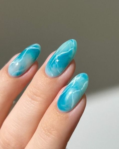 Aistė ❣︎ on Instagram: "🐬🫧 obsessing over marble nails lately :) and I love how bold and vibrant this teal color is !!  Using: @gelcare.official Coconut Milk | Jelly Teal | French Alps | Blooming Gel || For 15% off use code: AISTE _____ (*aff) #greennails #bluenails #marblenails #tealnails #pastelnails #springnails #nails #nailinspo #nailart  gradient ombre marbles, cute nails , almond nails , nail art tutorial," Marble Nails Teal, Green Blue Nails Ideas, Water Blue Nails, Blooming Gel Marble Nails, Blue Blooming Gel Nails, Summer Colors For Nails, Teal Marble Nails, Blue Teal Nails, Water Effect Nails