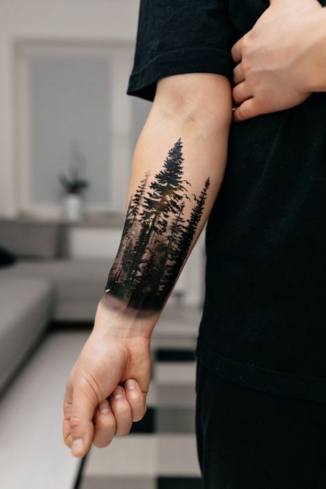 Explore the best meaningful forearm tattoo ideas for men with designs that carry deep significance. Pine Tree Arm Tattoo, Cottonwood Tree Tattoo, Loner Tattoos Men, Meaningful Men Tattoo Ideas Guys, Pine Forest Tattoo, Forest Tattoo Arm, The Forest Tattoo, Forest Sleeve Tattoo, Nature Tattoos For Men