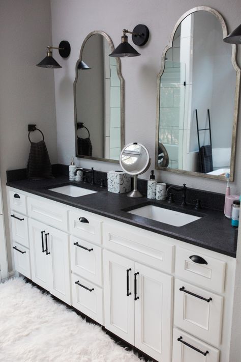 Black Bathroom Fixtures Gray Cabinets, White Walls Black Trim Bathroom, White Bathroom Black Countertop, Black Bathroom Vanity Countertop, Black Grey And White Bathroom Ideas, Black Counter In Bathroom, White Cabinets Black Granite Bathroom, Bathroom White Vanity Black Countertop, White Bathroom Vanity Black Countertop