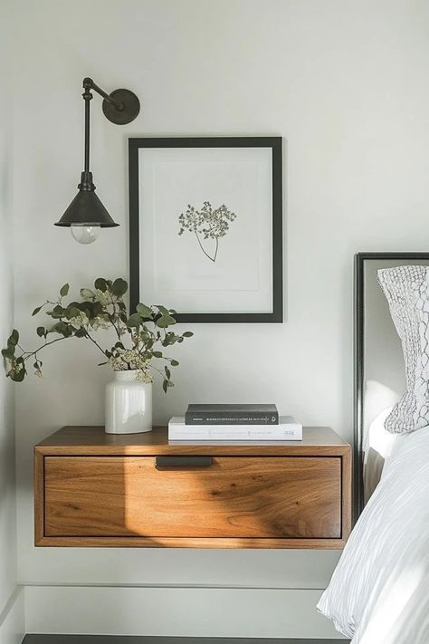 "Maximize space and style with floating nightstands! 🛏️✨ Perfect for creating a sleek, modern look in your bedroom. 🌟✨ #FloatingNightstand #BedroomDesign #SpaceSaving" Art Above Nightstand Bedside Tables, Floating Nightstand Bedroom Ideas, Hanging Light Over Nightstand, Floating Nightstands Bedroom, Floating Shelves Next To Bed, Floating Night Stand Ideas, One Nightstand Bedroom Layout, Bedroom Floating Nightstand, Floating Side Tables Bedroom