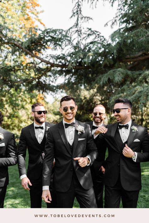 Groom and groomsmen group photo at Quail Ranch. This style embodies timeless elegance with classic black and white groom attire, complete with a sleek bowtie and a pristine white rose boutonniere. Perfect for the dapper groom seeking a look that's always in style for the big day. Follow the link for more inspiration. Photo credit: Stephanie Lynn Co. Photography Cream And Black Groomsmen, White Groom Attire, Black Bowtie Groomsmen, Black Groom Tan Groomsmen, Groom In Tan Groomsmen In Black, Black Groomsmen Attire, Groomsmen Black Suit Bowtie, Classic Groomsmen Attire Black, Groom Attire Black