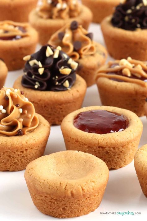 It is so easy to make soft and chewy peanut butter cookie cups which can be served plain or topped with chocolate ganache frosting, creamy peanut butter, or jelly. Peanut Butter Cups Cookies, Chocolate Peanut Butter Cup Cookies, Mini Peanut Butter Cup Cookies, Peanut Butter Cookie Cups, Buttery Ganache Cookie Cups, Chocolate Peanut Butter Cookie Cups, Peanut Butter And Jelly Cookie Cups, Reese’s Peanut Butter Cup Filling, Peanut Butter Jelly Cookies