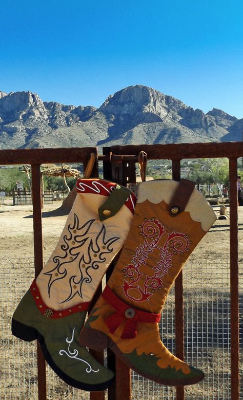 Cowboy boot Christmas stockings bask in the Tucson sun. Christmas Stocking Made From Felt, Country Stockings Christmas, Western Christmas Stockings Diy, Country Christmas Stockings Ideas, Cowboy Boot Stockings Western Christmas, Cowboy Boot Christmas Stocking Pattern, Cowboy Boot Christmas Decor, Cowboy Christmas Stocking, Western Stockings Christmas