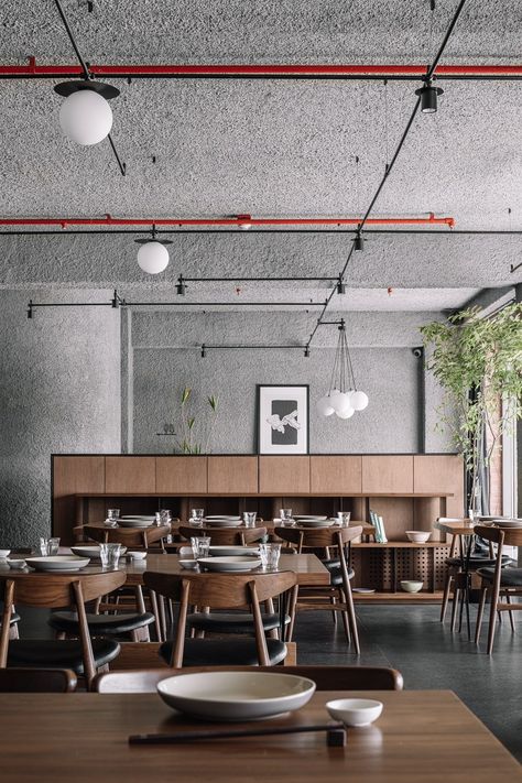 A pan-Asian restaurant in Surat with minimalist Japanese design | Architectural Digest India Pan Asian Restaurant Interior, Japanese Industrial Interior, Minimalist Japanese Restaurant, Japandi Restaurant, Japandi Industrial, Asian Restaurant Interior Design, Modern Asian Restaurant, Asian Restaurant Design, Family Style Restaurant