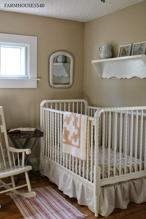 Farmhouse Nursery with white Jenny Lind spindle crib and neutral tan walls Primitive Nursery Ideas, Vintage White Crib Nursery Ideas, Shaker Style Nursery, White Jenny Lind Crib, Primitive Nursery, Baby Room Layout, Farmhouse Style Nursery, Girl Nursery Crib, Farmhouse Nursery Decor