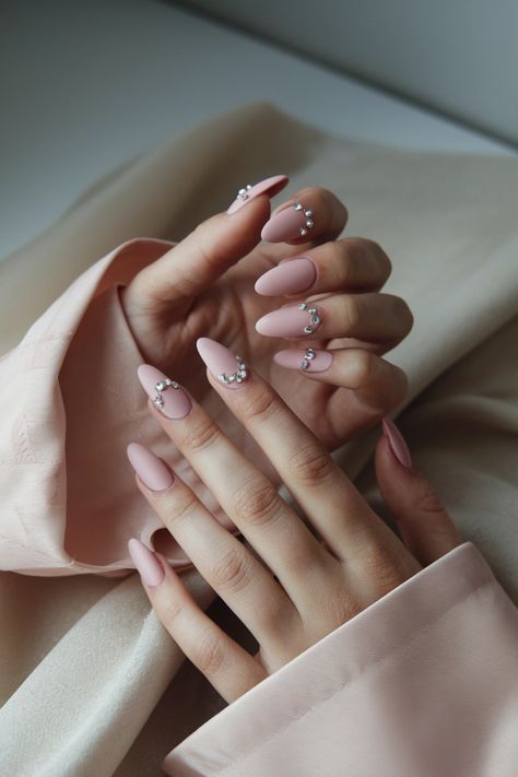 Elevate your style with these elegant matte pink nails, adorned with exquisite rhinestones that catch the light beautifully. This stunning design perfectly balances sophistication and sparkle, making it ideal for any occasion. Whether you opt for nail extensions or prefer natural nails, this look will leave you feeling glamorous. Embrace the chic allure of matte and shine with our favorite pink nails ideas! #PinkNails #NailArt #MatteNails #Rhinestones #NailDesigns Pink Nails Ideas, Matte Pink Nails, Nails Design With Rhinestones, Matte Pink, Pink Nail Designs, Nail Extensions, Matte Nails, Nails Designs, Nails Ideas