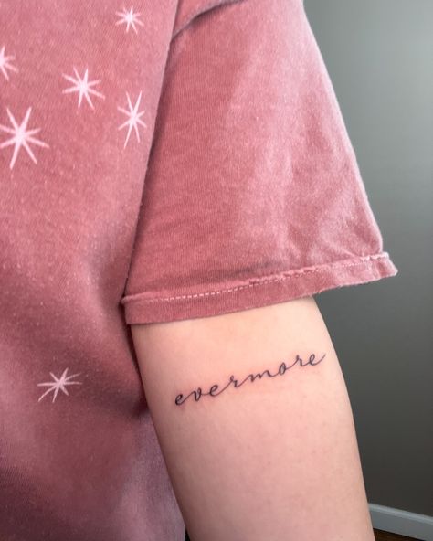 Tattoo in inner arm saying evermore. Taylor Swift song tattoo. Taylor Swift Tattoo Wouldve Couldve Shouldve, Evermore Tattoo Ideas, Taylor Swift Tattoos Evermore, Taylor Swift Tattoo Tolerate It, Evermore Tattoo Taylor Swift, Taylor Swift Inspired Tattoos Evermore, Evermore Tattoo, Taylor Swift Tattoo, Small Meaningful Tattoos