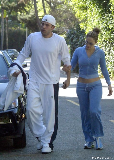 Ben Affleck's OG "Bennifer" Outfits Are a Total 2000s Vibe Velour Tracksuit Outfit, Jennifer Lopez 2000s, Velour Pants Outfit, 2000s Couples, 2000s Tracksuit, Outfit Jogging, Jlo And Ben Affleck, Jennifer Lopez And Ben Affleck, Nostalgic Fashion