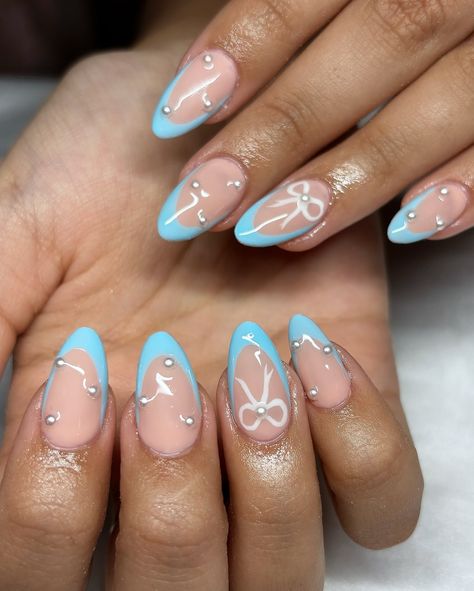 Baby Blue Bow Set 🎀🩵 • • • Apres Natural Almond Medium • IGel (I’m Blushing) • • #nails #nailsnailsnails #nailsofinstagram #nailsart #nailsbyavryl #gelx #gelxnails #gelxnailtech #explorepage #frenchtipnails #almondnails Blue Ribbon Nails, Christmas Nails Light Blue, Blue Bow Nails, Boy Baby Shower Nails, Baby Blue Christmas Nails, Blushing Nails, Baby Shower Nails Boy, Periwinkle Nails, Gender Reveal Nails