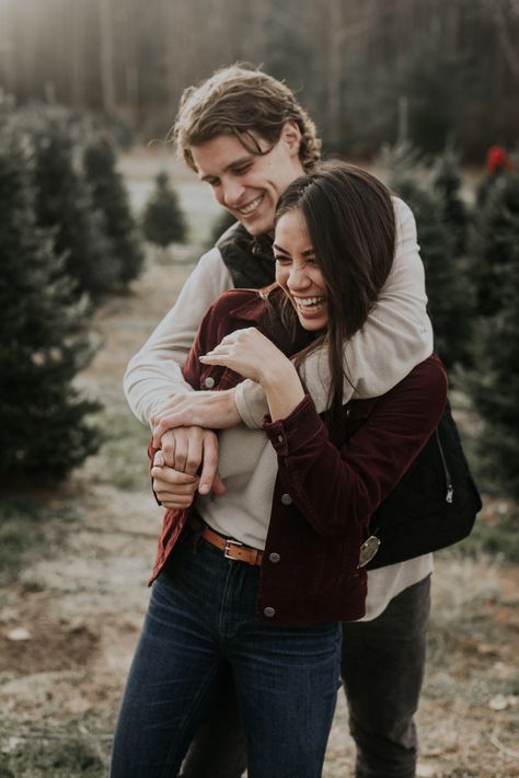 Holiday Tree Farm Family Photos, Tree Farm Couple Photos Outfit, Christmas Tree Pictures Couple, Couple Poses Christmas Tree, Christmas Tree Farm Photoshoot Couples, Christmas Tree Farm Mini Session Couple, Christmas Tree Farm Couples Photos, Christmas Tree Photoshoot Couple, Couples Tree Farm Photoshoot