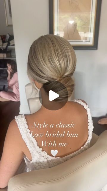 Kristen Okaly on Instagram: "Danielle 🤍 classic low buns always 🫶🏻 Mua @byalyssaa  . @sexyhair powder play . #bridalbun #updotutorial #njbridalhair #njhairstylist #updoeducator #njbride #brideinspiration #weddingreels #bridereels #parkchateauwedding #bridalhairstyle #classicbridalhair #bridalhairideas #njweddings #updoideas #bridetobe2025" Wedding Low Bun Hairstyles How To, Low Messy Bun Front View, Low Bun Wedding Hair Step By Step, Bridal Buns Low, Simple Hair Up Do, Bridal Hair Low Bun Blonde, Low Hairstyles Wedding, Twisted Updo Wedding, Low Bun With Front Pieces Curled