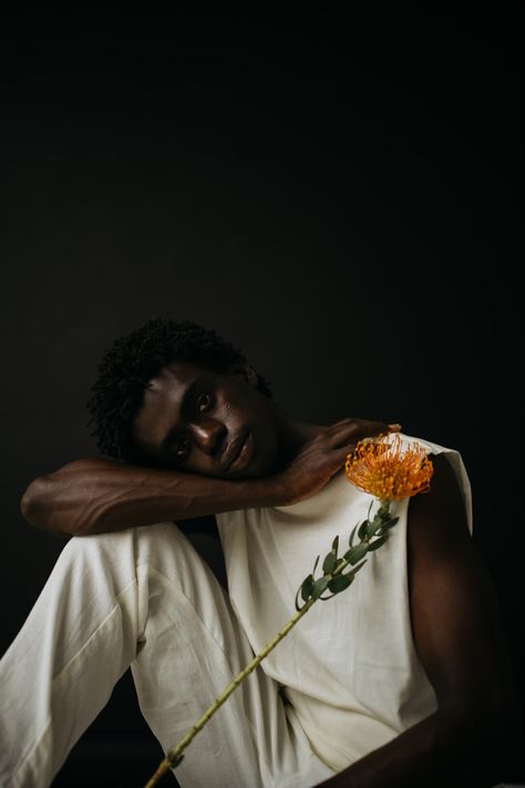 Black Male Poses Photography, Male Self Portrait Photography, Dark Male Photoshoot, Men And Flowers Photography, Black Man Photoshoot, Male Photoshoot Ideas Creative, Afrobeats Aesthetic, Male Flower Photoshoot, Modeling Concepts