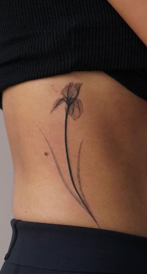 100 Unique and Meaningful Iris Tattoos - Tattoo Me Now Siberian Iris Tattoo, Delicate Iris Tattoo, White Dragonfly Tattoo, Iris Minimalist Tattoo, Botanical Tattoo Hip, Black And White Iris Tattoo, Iris Drawing Simple, Black Iris Tattoo, Inverse Tattoo