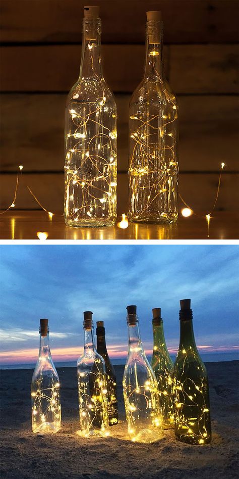 The summertime is the perfect time to display these stunning outdoor lighting ideas. I'm a big fan of these wine bottle cork lights. With these lights, fairy lights are connected to a faux wine cork. You simply place the cork in any wine bottle of your choice. What a great easy and quick DIY lights project. Valentine Wedding Decorations, Wine Corker, Led Garland, Empty Wine Bottles, Craft Lights, Lighted Wine Bottles, Wire Lights, Decoration Originale, Wine Bottle Decor