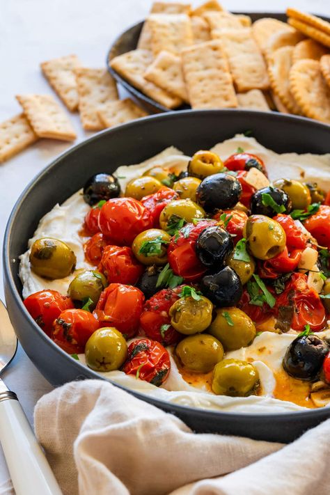 Homemade whipped feta dip with roasted tomatoes and olives ready to be served with crackers. Feta Tomato Dip, Whipped Feta Dip, Roasted Olives, Herb Stuffing, Vegetable Tray, Bread Easy, Feta Dip, Roasted Cherry, Whipped Feta