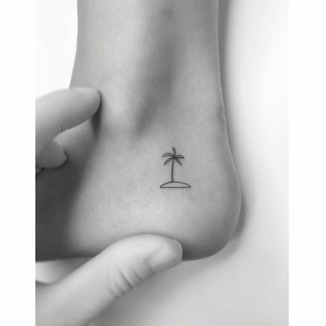 Minimalistic island and palm tree tattoo located on the Palm Tree Tattoo Ideas, Tree Line Tattoo, Palm Tree Tattoos, Back Of Ankle Tattoo, Palm Tree Tattoo Ankle, Island Tattoo, Palm Tree Island, Tree Tattoos, Palm Tattoos