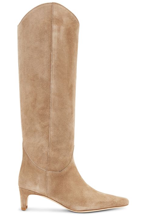 Find STAUD Western Wally Boot In Tan on Editorialist. Staud Western Wally Boot in Tan Suede upper with leather sole. Made in Portugal. Pull-on styling. Leather footbed and lining. Square toe with kitten heel. Approx 50mm/ 2 inch heel Approx 381mm/ 15 inch shaft Shaft measures approx 18.8 in circumference. STAD-WZ22. F24P1008CS. About the designer: After an impressive stint as a fashion stylist and director, Sarah Staudinger took a stab at venturing solo with her namesake brand STUAD. Co-founded with partner, George Augusto in 2015, this LA-cool girl collection of dresses, handbags and footwear insists upon the notion that fashion shouldn’t just empower women — it should be accessible, too.At heart of STAUD is design, think: scrupulous attention to detail, a natural opposition tothe typical Staud Wally Boot Outfit, Fitted Cream Western Boots, Beige Fitted Western Boots, Cowboy Boots Fall 2024, Tall Briwn Boots, Sarah Staudinger, Suede Boots Outfit, Fall Thrift, Tan Suede Boots