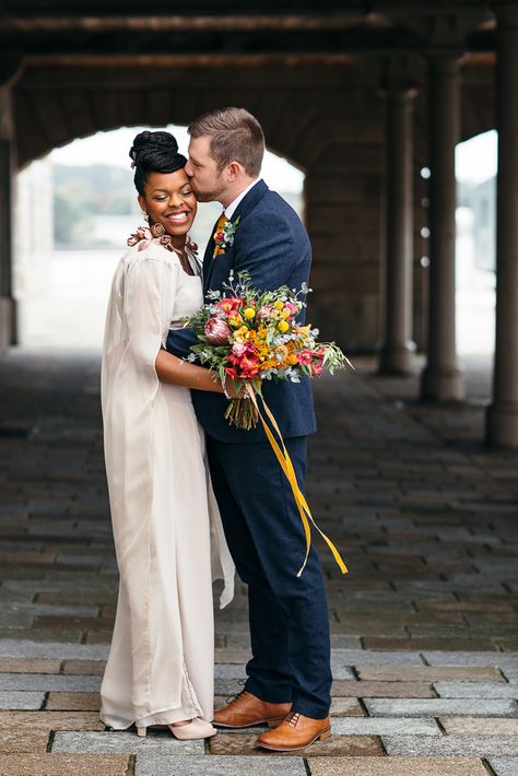 Bride in Bespoke Ailsa Monroe Jumpsuit & Cape | Groom in Next Navy Wool Suit | Relaxed Industrial Wedding at Ocean Studios, Plymouth | Freckle Photography Jumpsuit Cape, Freckle Photography, Navy Wool Suit, Groom Photoshoot, Bridal Outfit, Couple Wedding, Bridal Shoot, Bright Flowers, Industrial Wedding