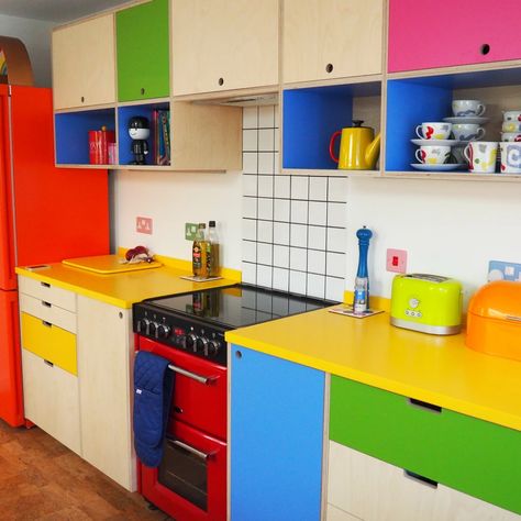 Bright and fun modern kitchen - super colourful with yellow worktop and plywood and formica cupboards with open shelving. Very fun quirky kitchen! Quirky Kitchen Decor, Clothing Prints, Colourful Kitchen, Plywood Kitchen, Quirky Kitchen, Urban Interiors, House Things, Anything Goes, Kitchen Decor Items