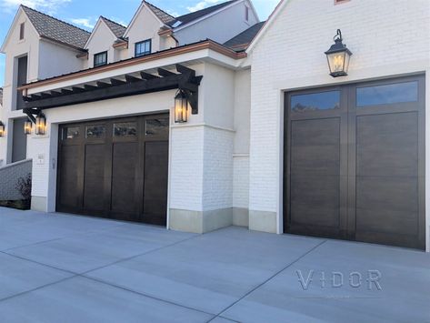 Eyebrow Above Garage Door, Urban Bronze Garage Door, Urbane Bronze Garage Door, Garage Door Ideas Curb Appeal, Dark Brown Garage Doors White House, Barrel Garage Doors, Vidor Garage Doors, Deep Brown Garage Door, Martin Garage Doors