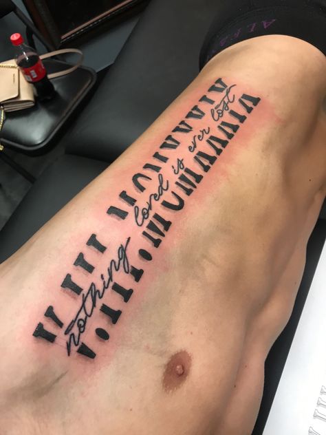 Roman numerals tattoo rib cage memorial quote black Ribcage Roman Numeral Tattoo, Roman Numerals Rib Tattoo, Name Rib Tattoo, Roman Numeral Tattoo On Ribs, Oblique Tattoo, Rib Tattoos For Guys Quotes, Side Tattoos For Men Ribs Quotes, Rib Cage Tattoos For Men, Roman Numerals On Ribs