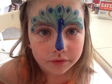 Peacock face paint. This one is so cute! Face Paint Peacock, Zoo Face Paint, Zoo Animal Face Paint, Peacock Face Paint, Bird Face Paint, Animal Face Paint, Peacock Face Painting, Animal Face Paintings, Face Painting Tips