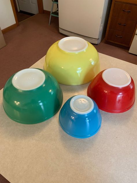 This is a nice survivor set of Pyrex mixing bowls in the Primary Colors. Each bowl has a few marks here and there, but in no way do they distract from the beauty of this brightly colored set. The very small marks cannot be picked up by my camera. I have tried to picture the small marks on the small red bowl. The rest of the set is very clean. Vintage Pyrex Collection, Pyrex Display, Vintage Dishes Antiques, Pyrex Vintage Rare, Pyrex Primary Colors, Vintage Pyrex Dishes, Pyrex Dishes, Pyrex Collection, Child Hood