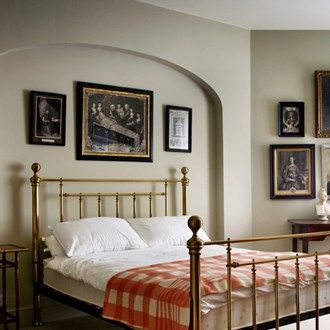 In the spare bedroom, a gallery wall of antique pictures has been coupled with a brass bed-frame and gingham bedspread. English Country Bedroom, English Bedroom, Bedroom Marble, Brass Bed Frame, Country Style Bedroom, Living Colors, Brass Bed, Cottage Bedroom, Country Bedroom