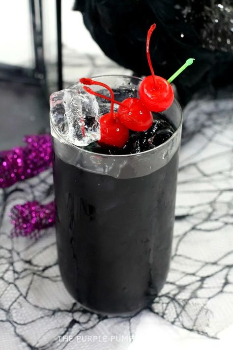 This jet-black Raven Cocktail is made with Jägermeister and rum and is a fantastic drink to serve at Halloween parties! #HalloweenCocktails #ThePurplePumpkinBlog Black Colored Drinks, Purple Rum Cocktail, Black Cocktails For Halloween, Black Drink Aesthetic, Black Mixed Drinks, Black Cocktail Drink, Black Drinks Cocktails, Raven Cocktail, Gothic Drinks