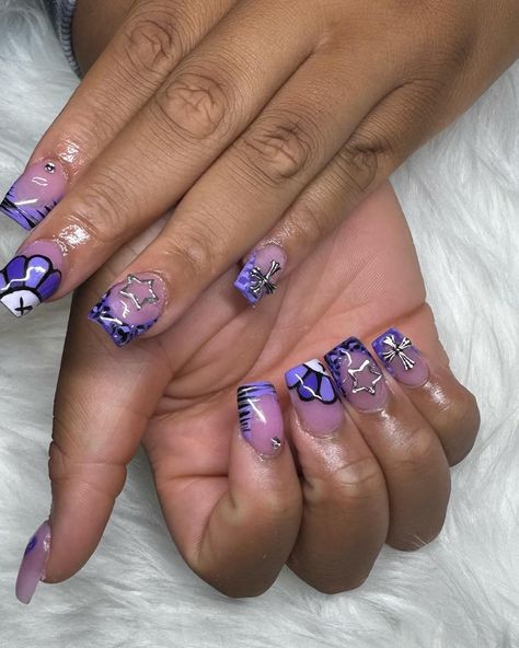 Purple KAWS set💜🖤🩶 Birthday Purple Nails, Purple Acrylic Nails Birthday Set, Purple Kaws Nails, Purple Nail Designs Short, Light Purple Nails Black Women, Purple Acrylic Nails With Charms, Short Purple Nail Designs, Purple Kaws, Kaws Nails Short Pink