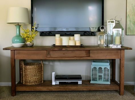 wall mounted tv console | Wall mounted TV with console table underneath: I really like how they ... Tv Display Ideas Living Room, Under Tv, Rustic Console Tables, Mounted Tv, Style At Home, Tv Wall, Apartment Living, Home Fashion, Entertainment Center