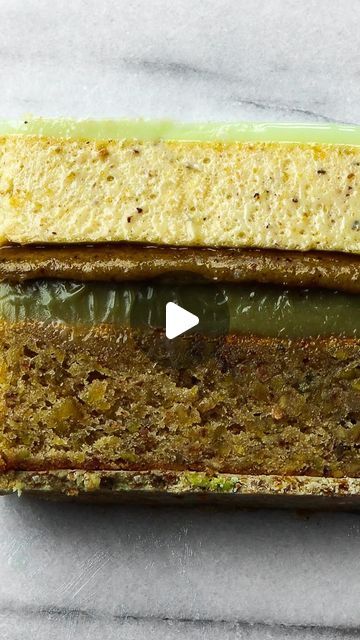 Louise Lindberg Bonfils Høck on Instagram: "The most amazing Pistachio Cake 💚

If you’re a pistachio lover like myself, then save this post for the next time you want to bake a pistachio cake and watch my step-by-step YouTube guide via link in bio 🥰

You know I love all my cakes. But this one is so special. The flavour is really out of this world! 😮 
I love pistachio and this cake has 5 (!) layers of pistachio! 
If you’re a pistachio-fan like me, you have to try this one 😍

The cake consists of:
- Pistachio Crunch
- Pistachio Cake
- Pistachio Ganache
- Pistachio Praliné
- Pistachio Mousse
- Mirror Glaze
- Chocolate Decoration

Instead of posting step-by-step in the stories here like I normally do, I’m trying out a new concept where I post a long-form YouTube video instead, as I’m actua Pistachio Cake Decoration, Pistachio Chocolate Cake, Pistachio Mousse Cake, Pistachio Crunch, Pistachio Ganache, Pistachio Mousse, Cake Pistachio, Entremet Cake, Youtube Guide